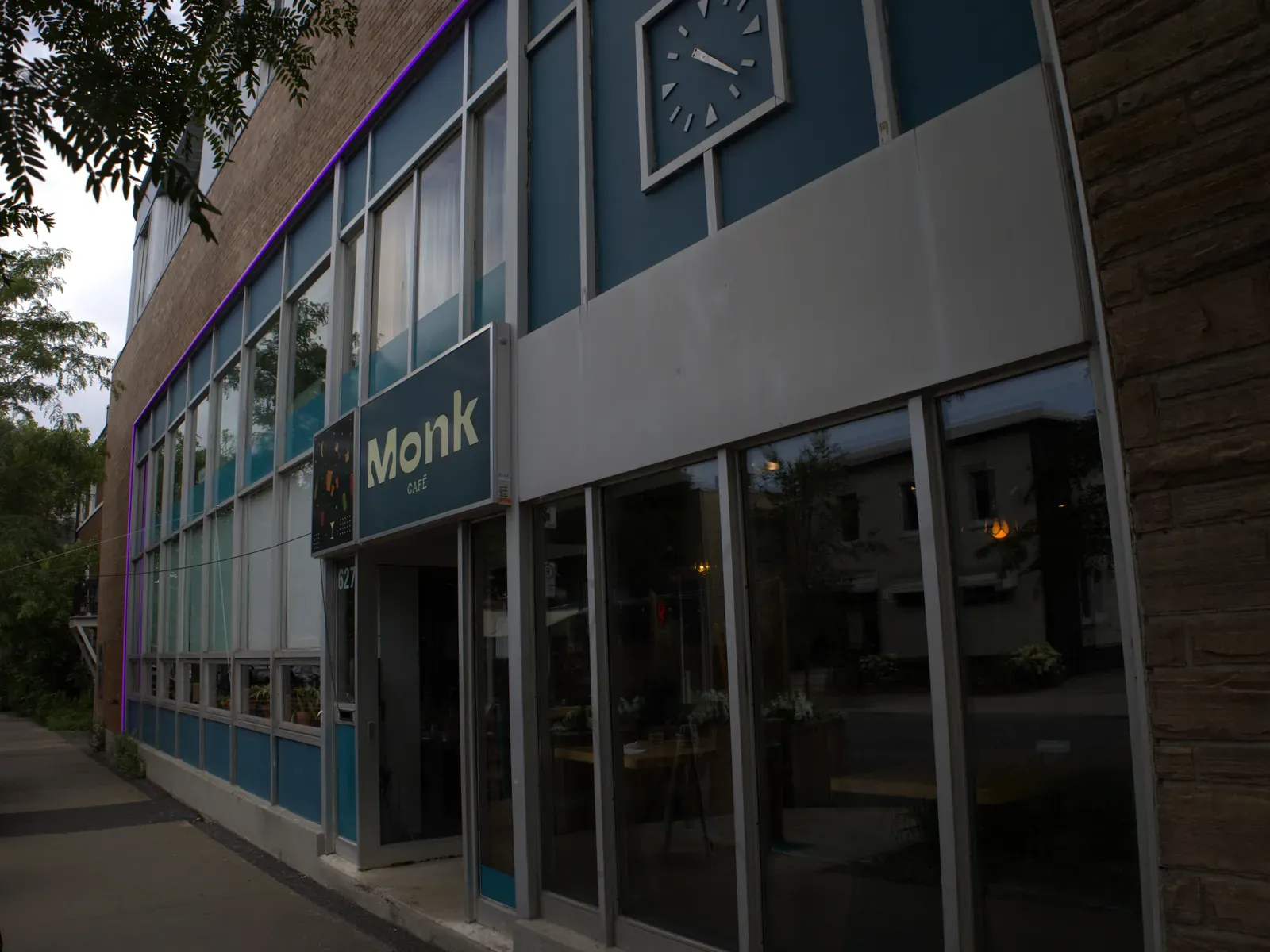 Vision Bleu permanent LED lighting on a café storefront