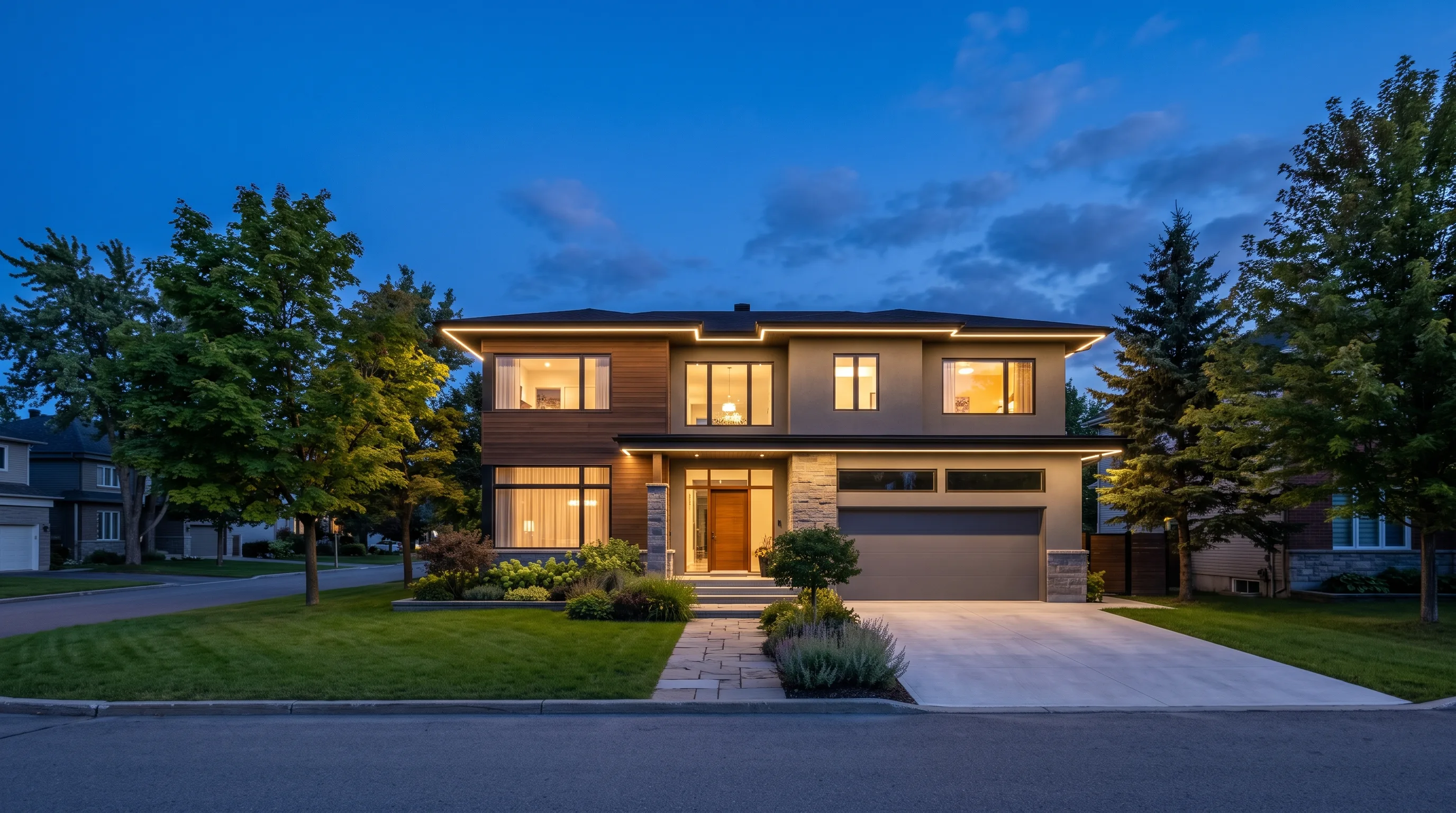 A house facade lit in warm white along the roofline at dusk on a Quebec residential street